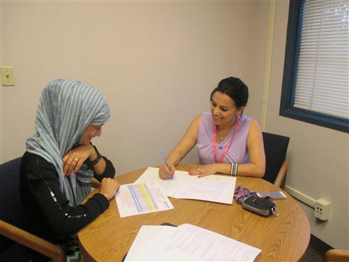 FACE Office Community Liaison meets with a newcomer family 